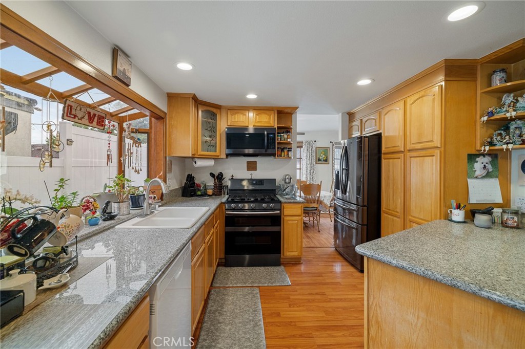 2158 Waldo Street Simi Valley, CA 93065 - Photo 6 of 46 a kitchen with stainless steel appliances granite countertop sink stove and refrigerator