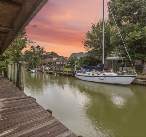 a view of a lake with boats and trees in the background