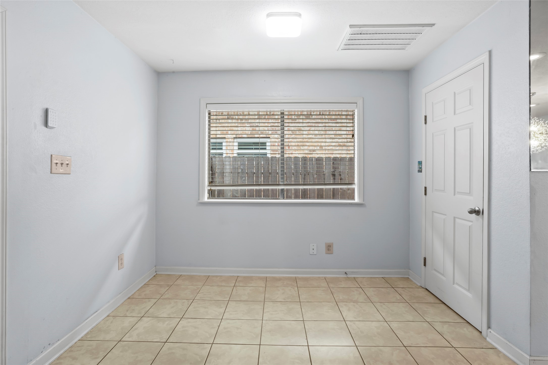 16 Harbor Lane Kemah, TX 77565 - Photo 12 of 31 a view of an empty room with window and chandelier fan