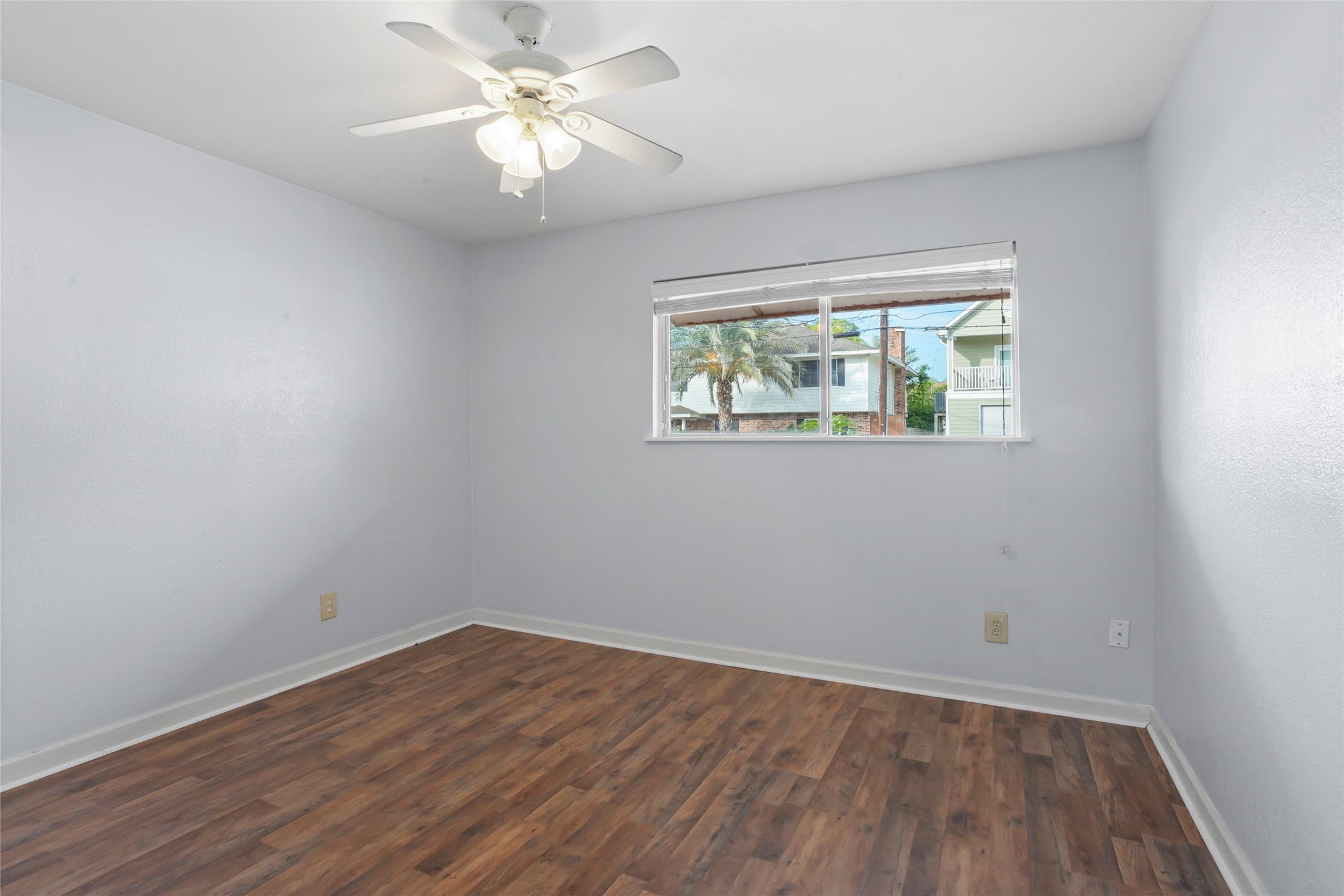 16 Harbor Lane Kemah, TX 77565 - Photo 21 of 31 wooden floor in an empty room with a window