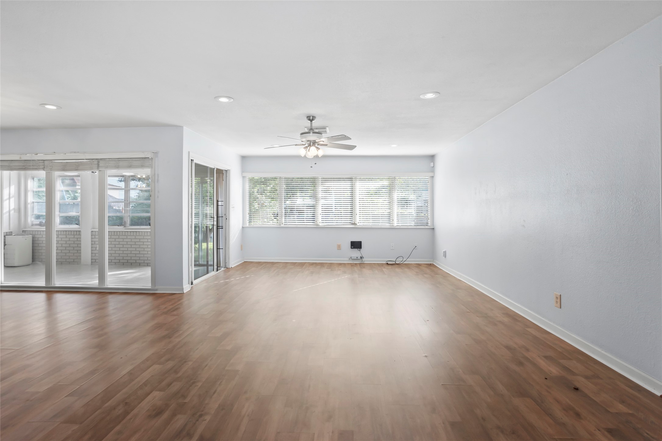 16 Harbor Lane Kemah, TX 77565 - Photo 7 of 31 wooden floor in an empty room with a window