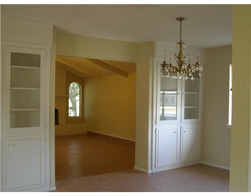 5325 Crestwick Drive Corpus Christi, TX 78413 - Photo 3 of 3 a view of a room with a chandelier fan and windows