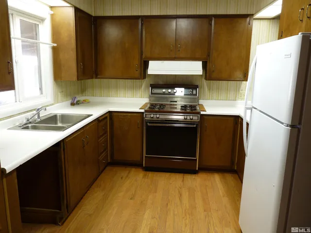 an empty room with wooden floor
