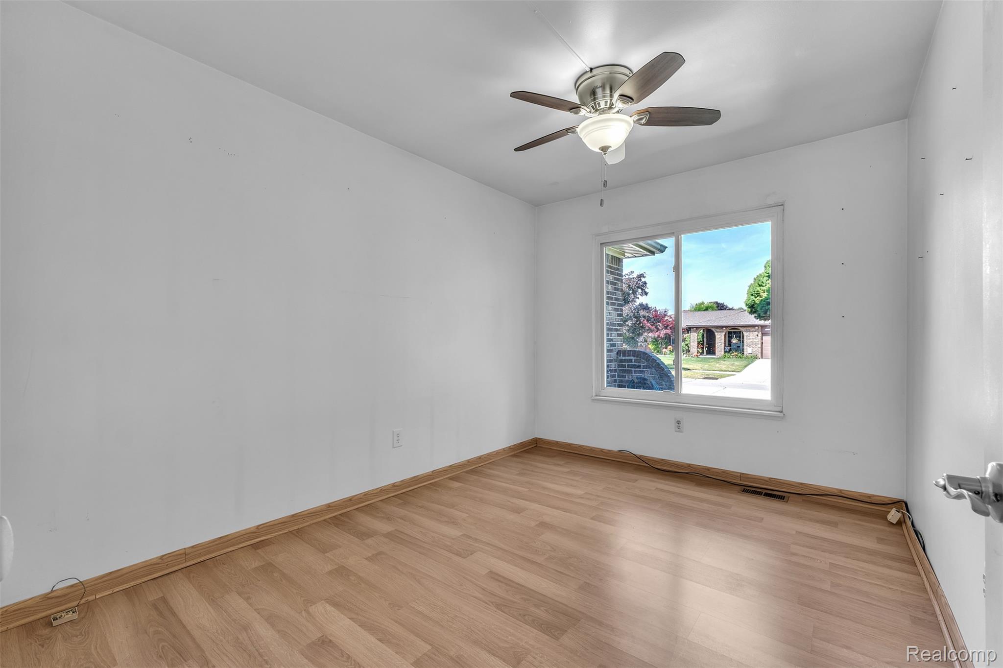 7000 Woonsocket Street Canton, MI 48187 - Photo 32 of 65 Neutral wall finishes, wood-finish flooring, and a ceiling fan with light fixture