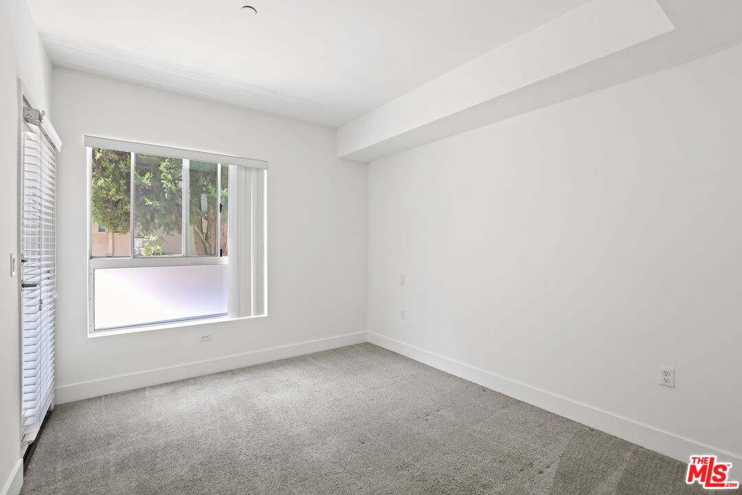 1411 Barry Avenue, Unit 306 Los Angeles, CA 90025 - Photo 12 of 14 an empty room with a window