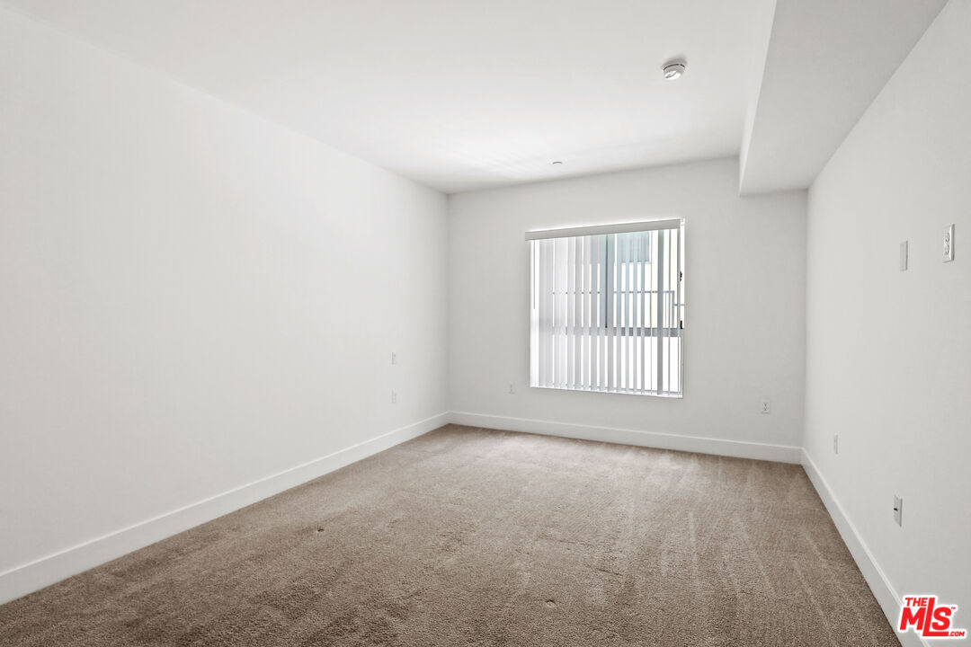 1411 Barry Avenue, Unit 306 Los Angeles, CA 90025 - Photo 10 of 14 an empty room with a window