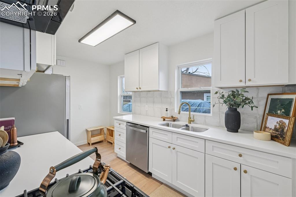 740 East Rio Grande Street Colorado Springs, CO 80903 - Photo 14 of 25 a kitchen with a sink cabinets and window