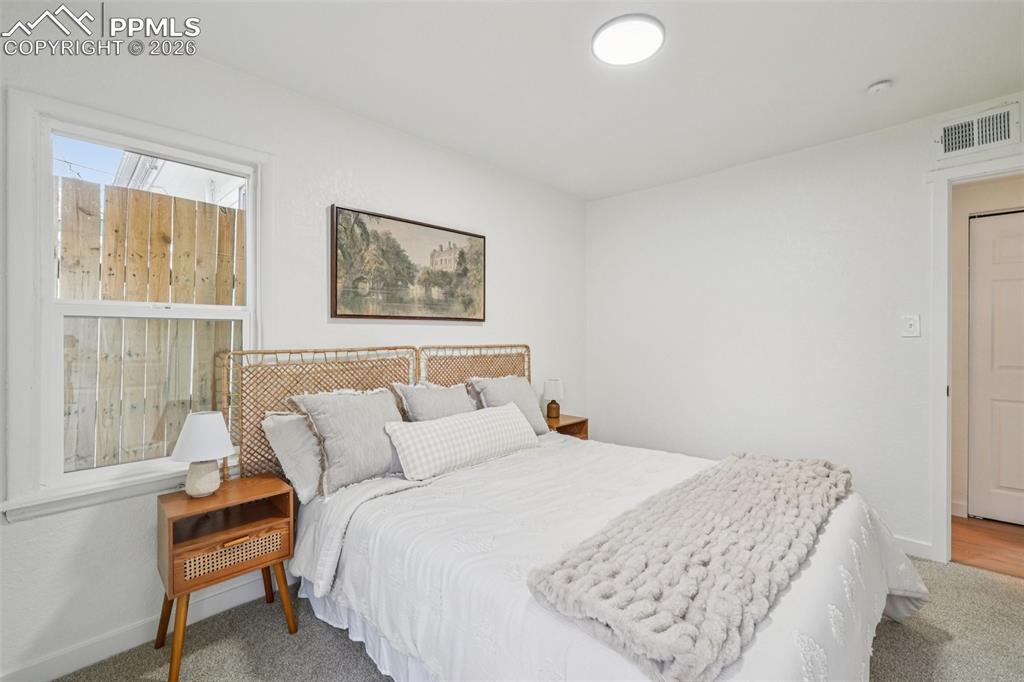 740 East Rio Grande Street Colorado Springs, CO 80903 - Photo 18 of 25 a bedroom with a bed and a window