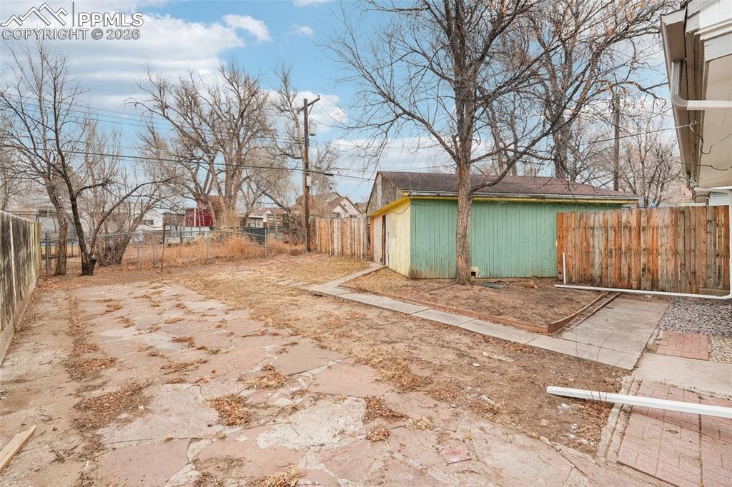740 East Rio Grande Street Colorado Springs, CO 80903 - Photo 22 of 25 a front view of a house with a yard covered with snow