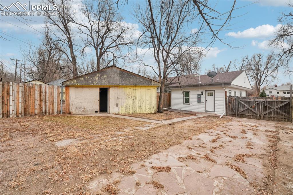 740 East Rio Grande Street Colorado Springs, CO 80903 - Photo 23 of 25 a front view of a house with a yard and garage