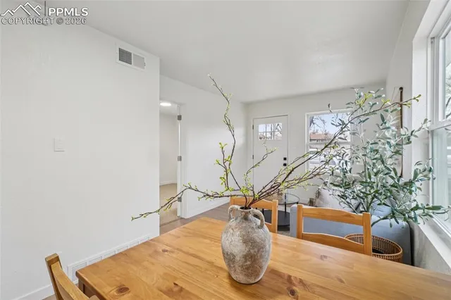 a view of entryway and hall with a wooden floor