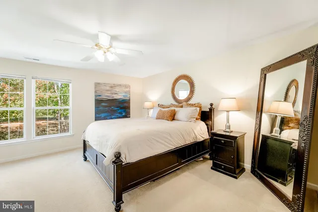 a bed room with a bed and a large window