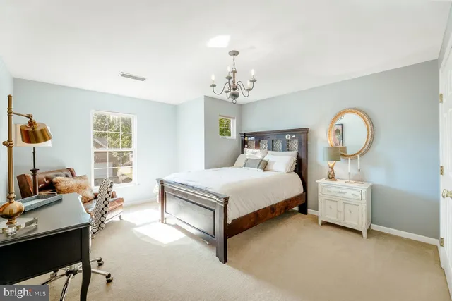 a bed room with a bed and window