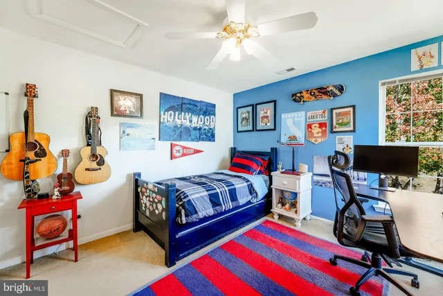 a bedroom with bed and furniture