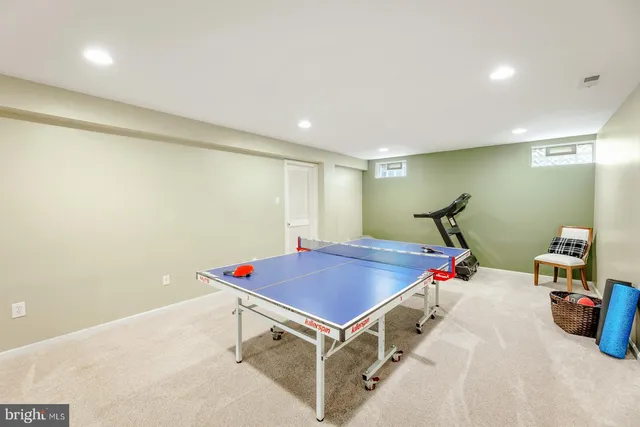 a room with table and air hockey table