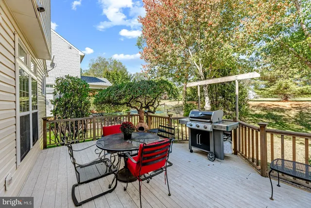 a view of a chairs and table in the balcony