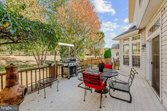a backyard of a house with outdoor seating