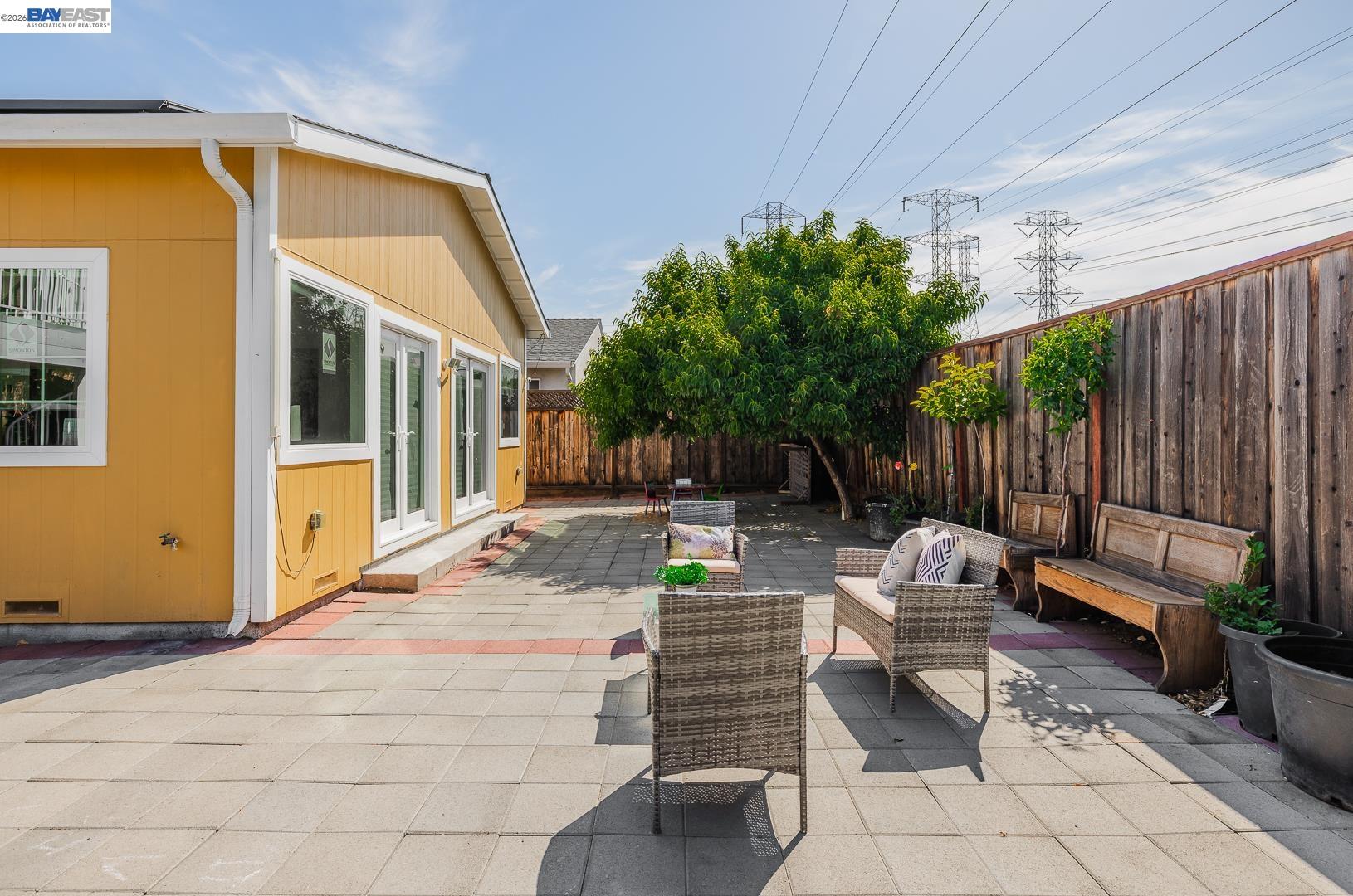 4032 Doane Street Fremont, CA 94538 - Photo 28 of 39 a backyard of a house with fountain table and chairs