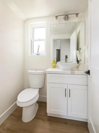 a bedroom with a bed and a view of bathroom