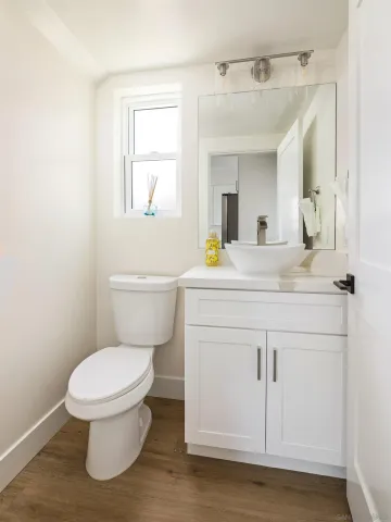 a bedroom with a bed and a view of bathroom