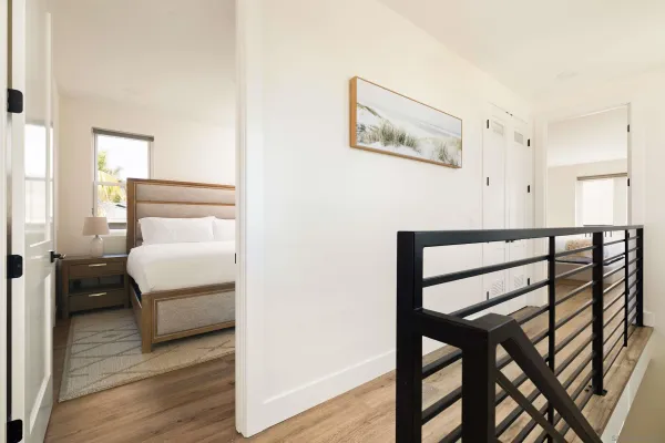 a bedroom with a bed and a table
