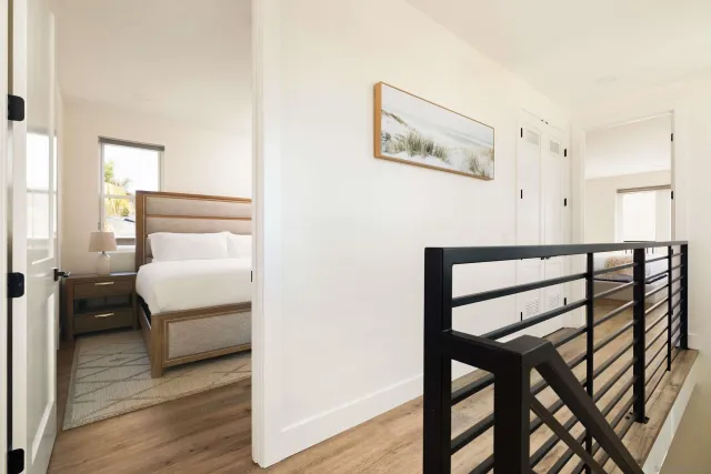 a bedroom with a bed and a table