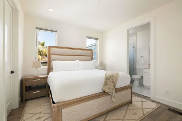 a bedroom with a bed and a view of bathroom