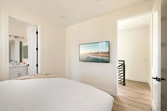 a bathroom with a sink toilet vanity and shower