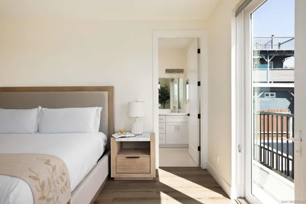 a bathroom with a double vanity sink toilet and shower