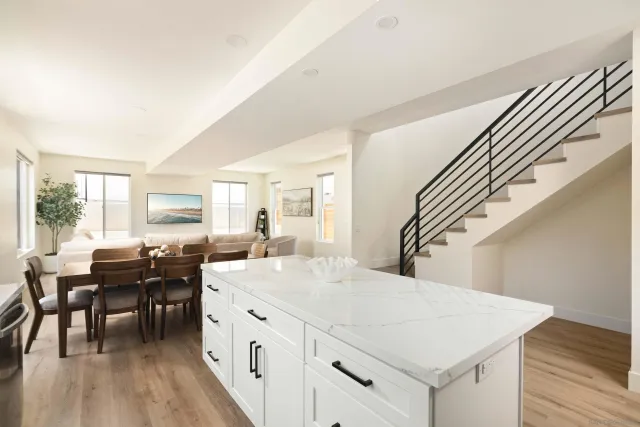 a kitchen with sink cabinets and wooden floor