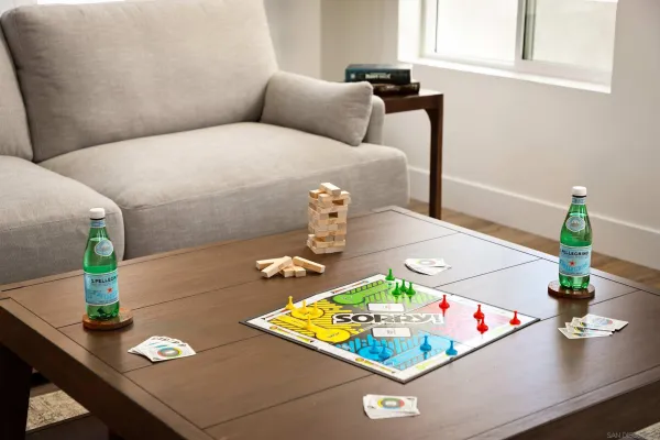 a living room with furniture and flowers