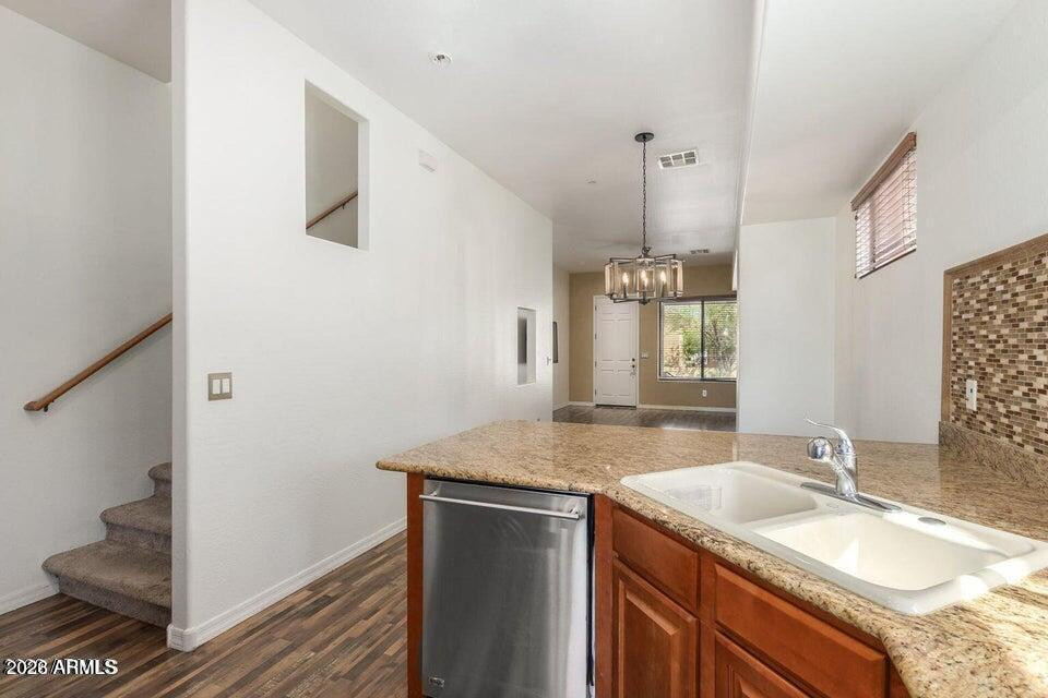 9551 East Redfield Road, Unit 1008 Scottsdale, AZ 85260 - Photo 13 of 19 a bathroom with a granite countertop sink and a mirror