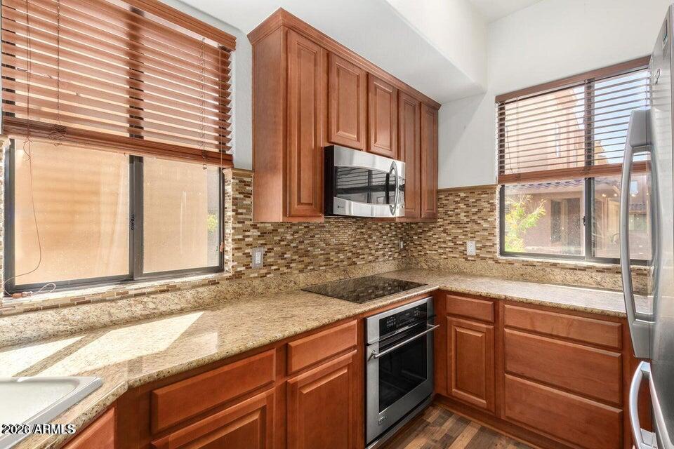 9551 East Redfield Road, Unit 1008 Scottsdale, AZ 85260 - Photo 10 of 19 a kitchen with a sink and a window
