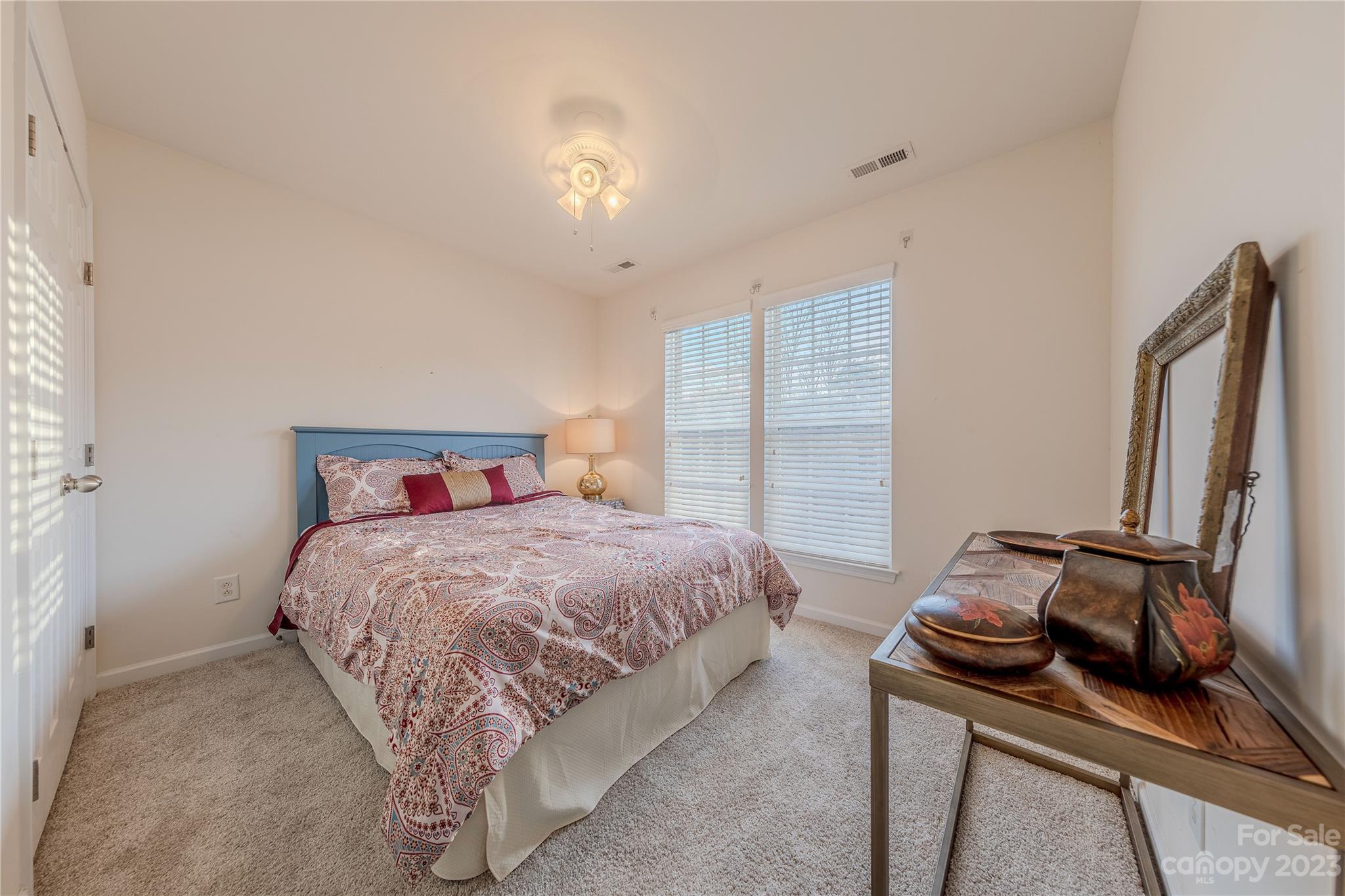 342 Lorraine Road Fort Mill, SC 29708 - Photo 26 of 34 a bedroom with a bed and a dresser