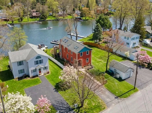 an aerial view of a house with a lake view