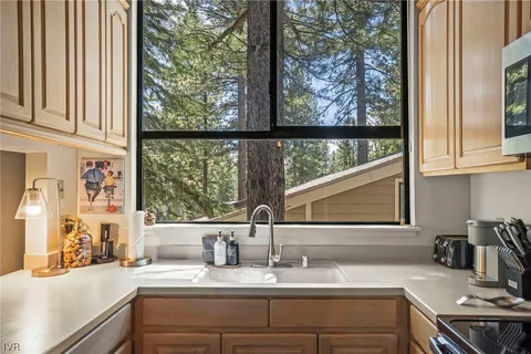 a bathroom with a sink and a window