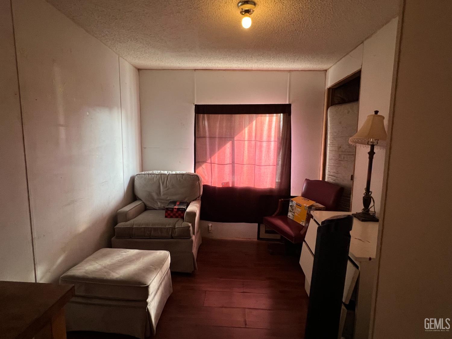 Undisclosed Address Bakersfield, CA 93309 - Photo 10 of 14 a living room with furniture and a window