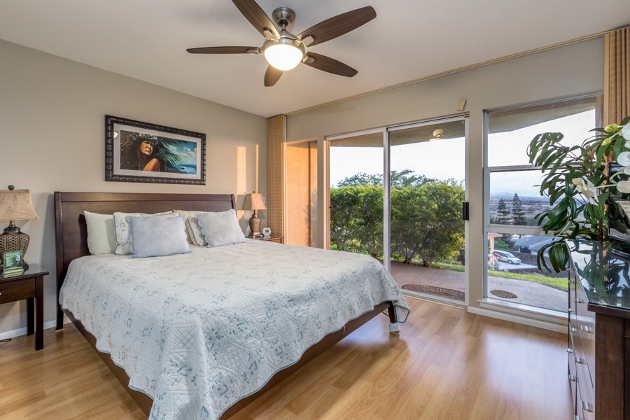 68-1745 Waikoloa Road, Unit L101 Waikoloa, HI 96738 - Photo 9 of 27 a bedroom with a large bed and a large window