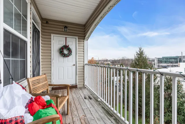 a view of balcony with wooden floor