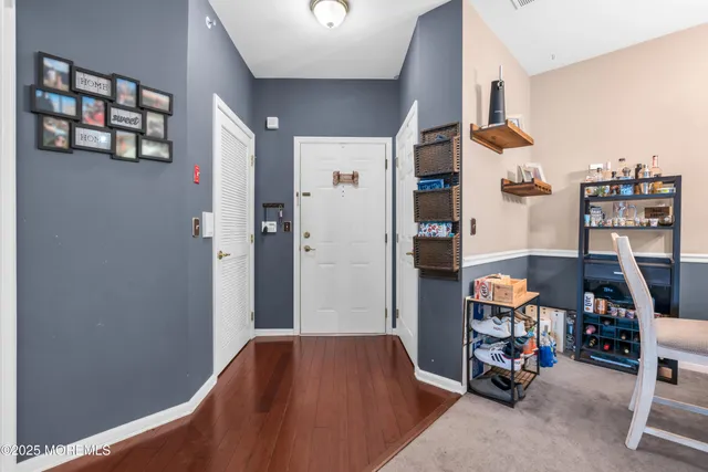 a bedroom with a bed and a book shelf
