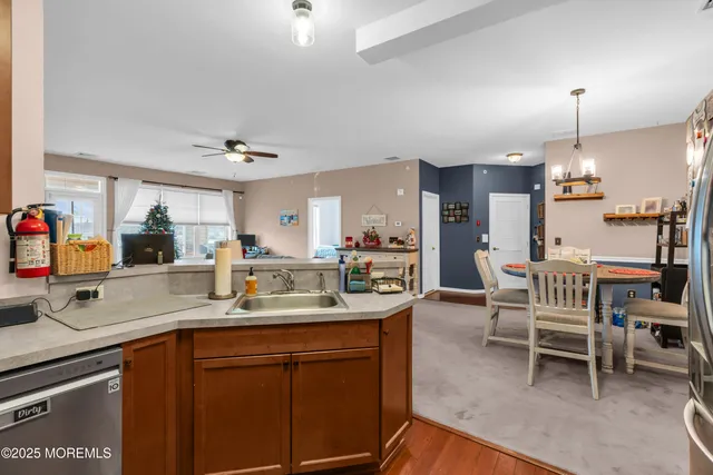 a kitchen with a sink cabinets and window