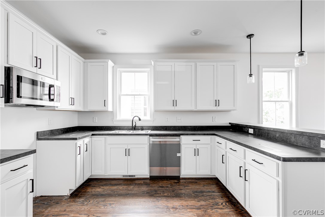 2405 Everett Street Richmond, VA 23224 - Photo 8 of 24 a kitchen with granite countertop white cabinets and white appliances