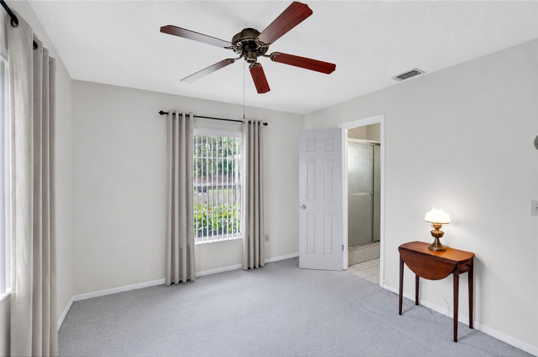 7666 134th Street Sebastian, FL 32958 - Photo 11 of 35 a view of room with a ceiling fan and a window