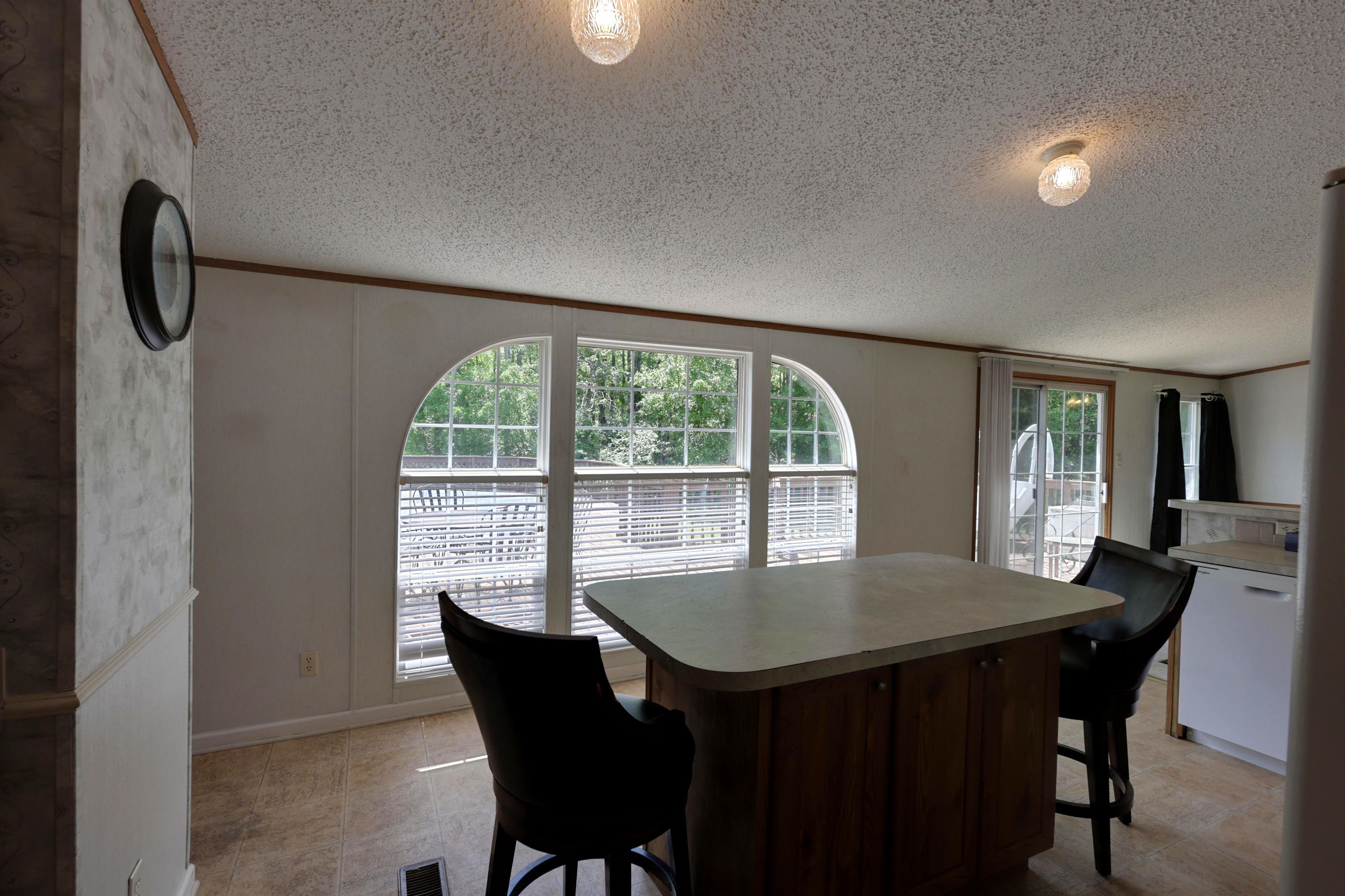 39 Cr 360 Road Iuka, MS 38852 - Photo 13 of 31 a view of a dining room with furniture window and outside view
