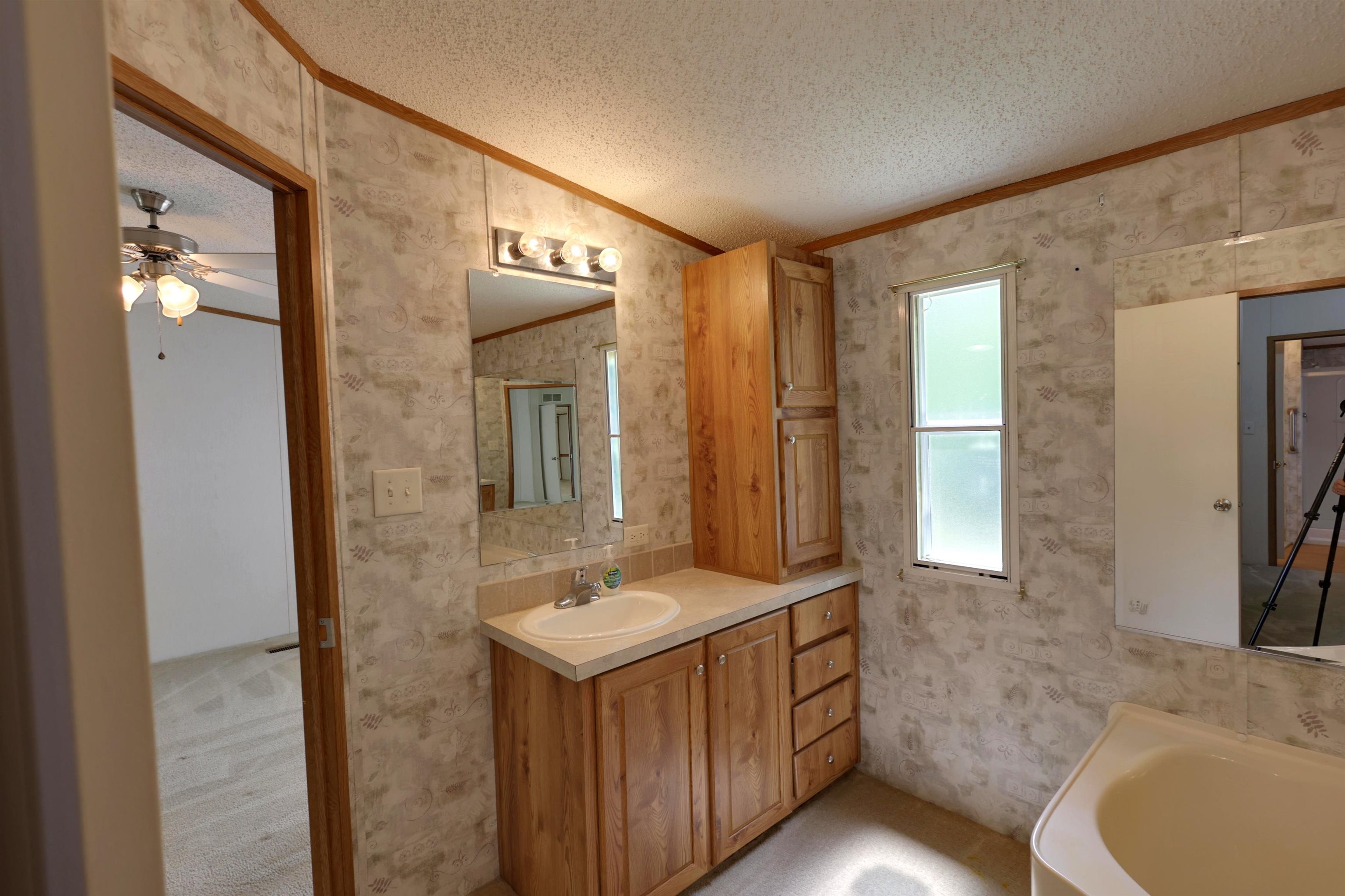 39 Cr 360 Road Iuka, MS 38852 - Photo 16 of 31 a bathroom with a sink and a mirror