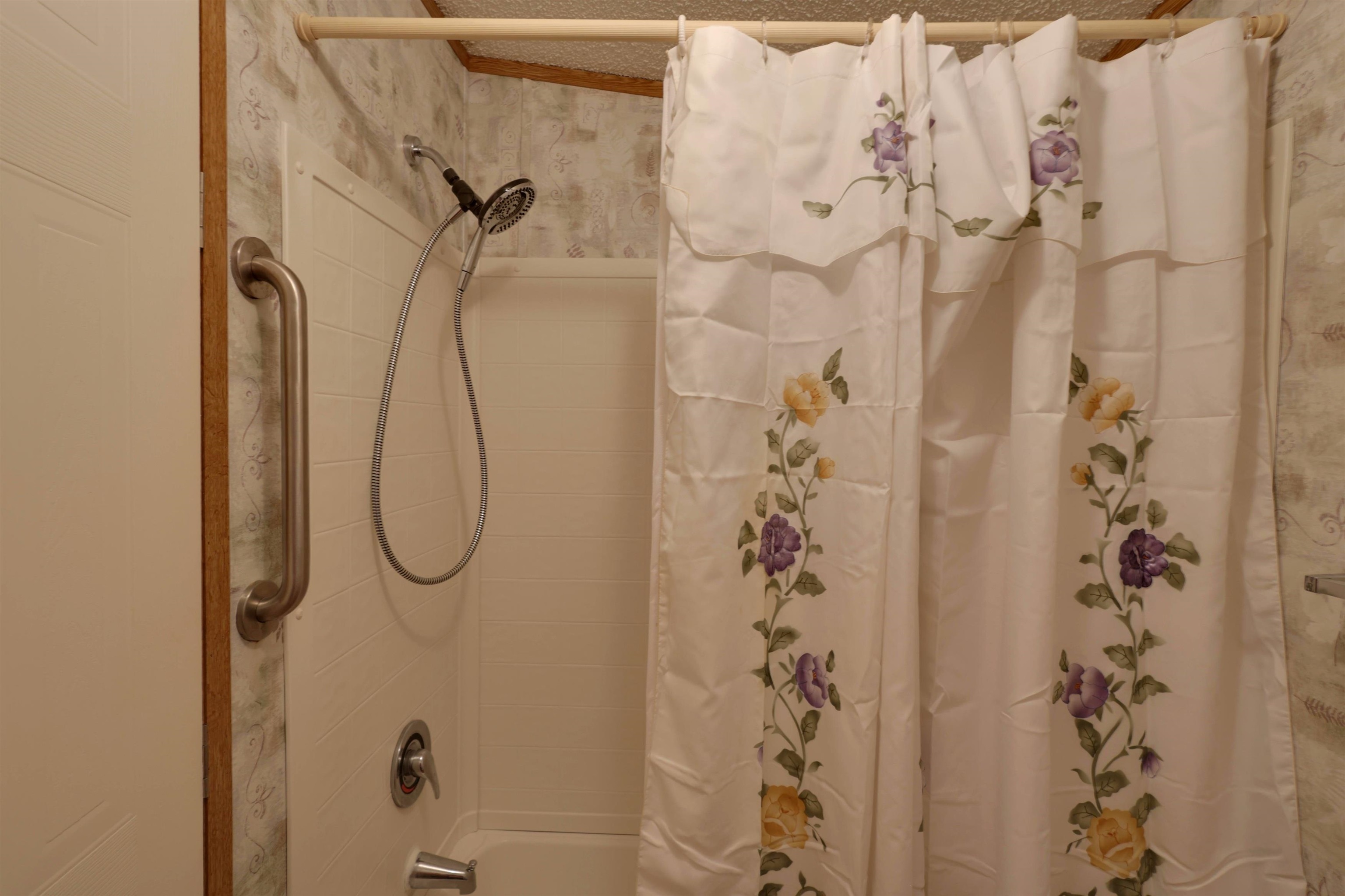 39 Cr 360 Road Iuka, MS 38852 - Photo 23 of 31 a bathroom with a shower and a shower curtain