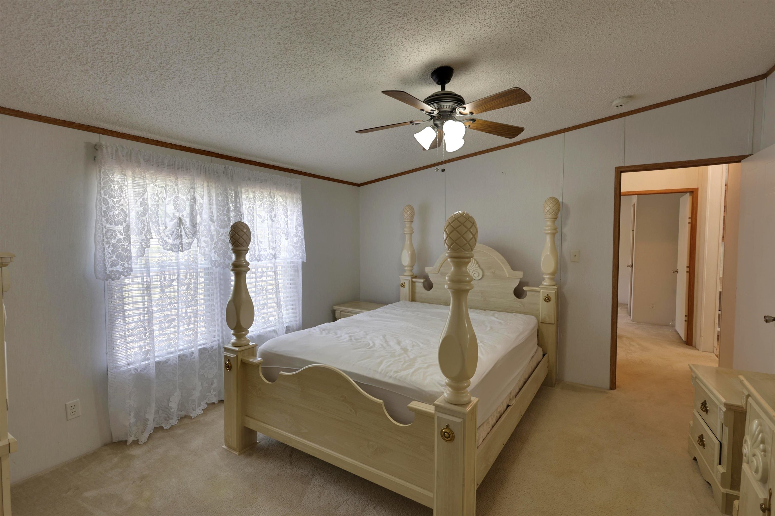 39 Cr 360 Road Iuka, MS 38852 - Photo 25 of 31 a bed room with a bed and a chandelier