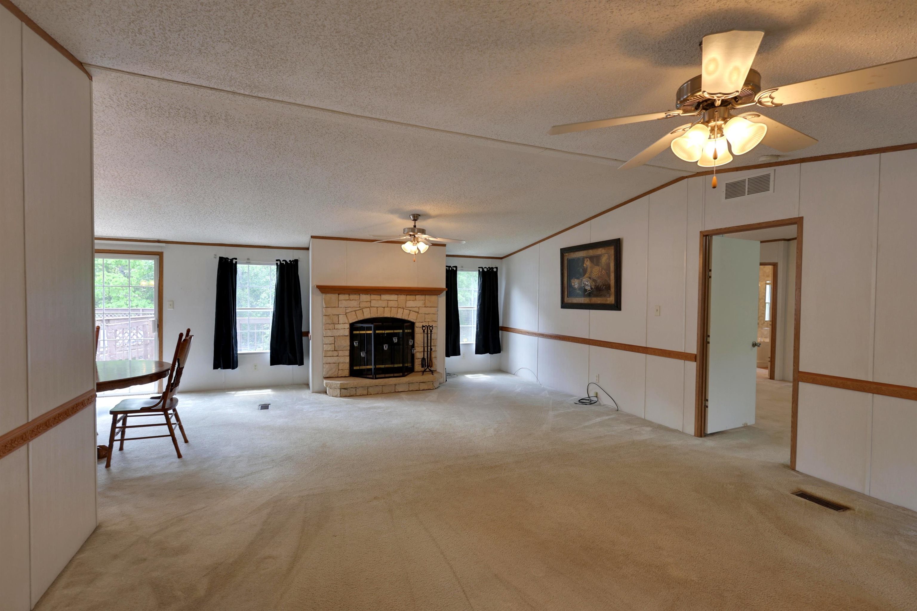 39 Cr 360 Road Iuka, MS 38852 - Photo 4 of 31 a view of a livingroom with an empty space and a fireplace