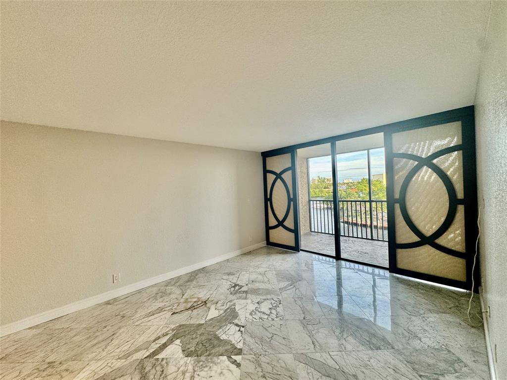 13 Royal Palm Way, Unit 5050 Boca Raton, FL 33432 - Photo 11 of 31 a view of a livingroom with furniture and staircase