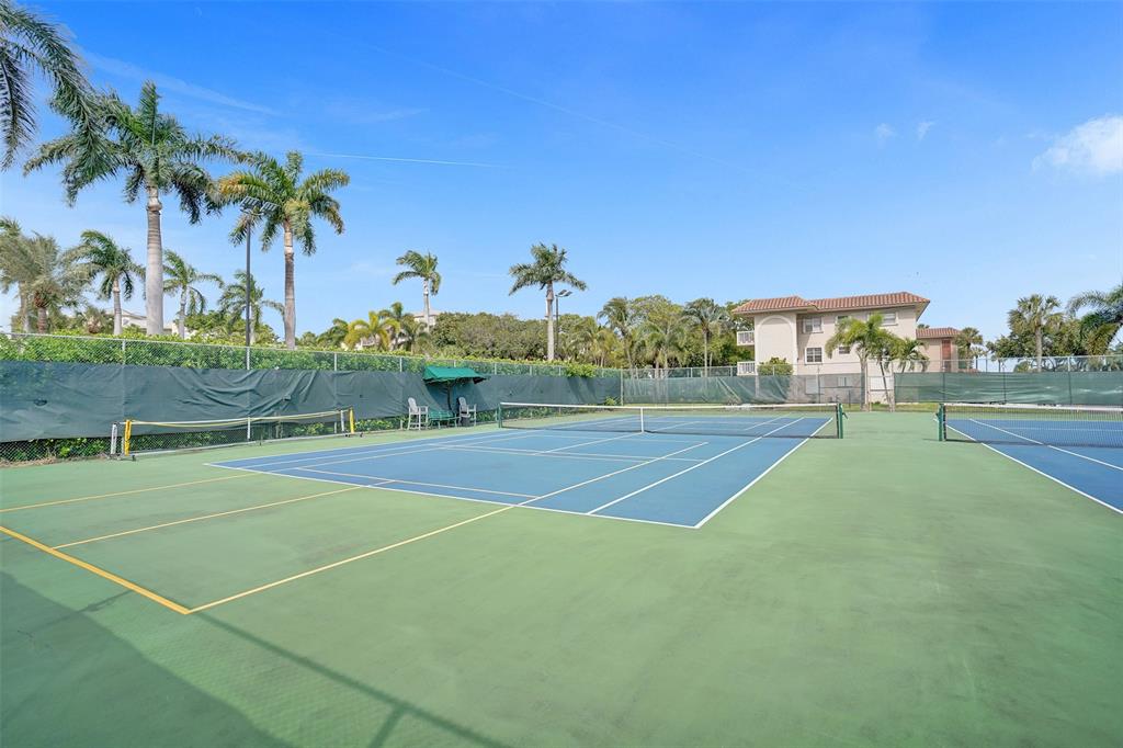 13 Royal Palm Way, Unit 5050 Boca Raton, FL 33432 - Photo 27 of 31 a view of a tennis court